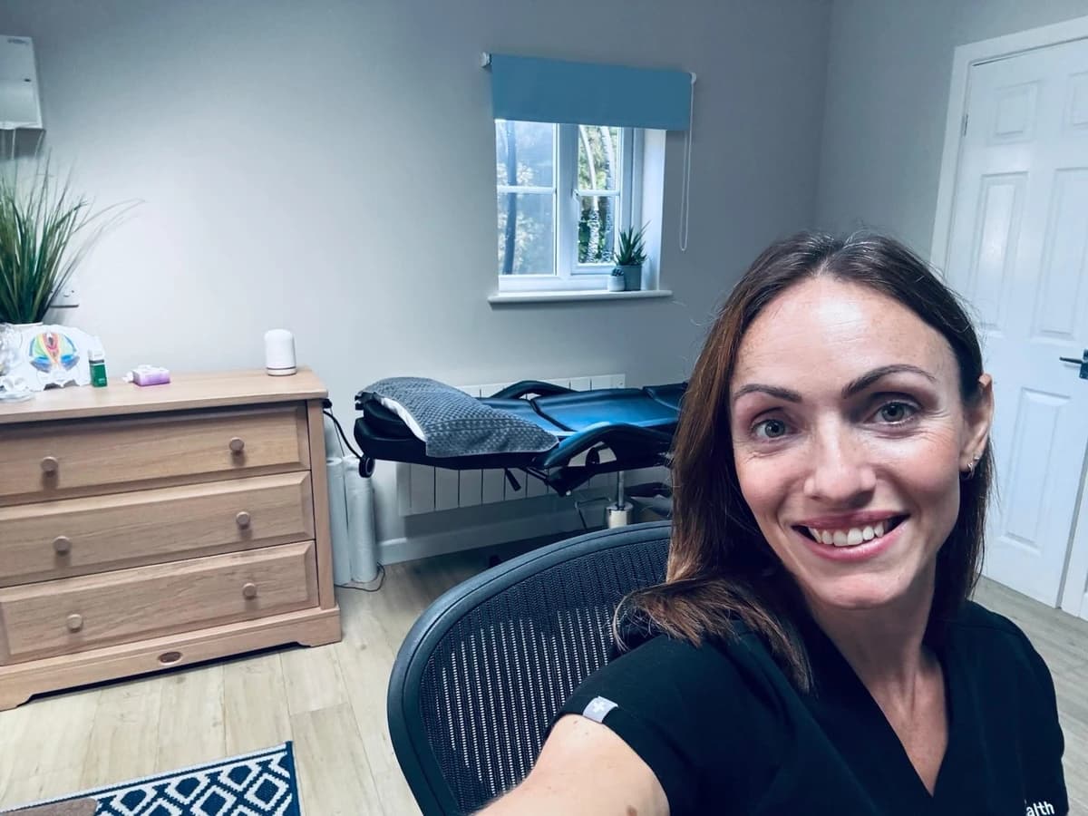 Bex Rotheram in the Northenden clinic, with the treatment couch and pelvic health models